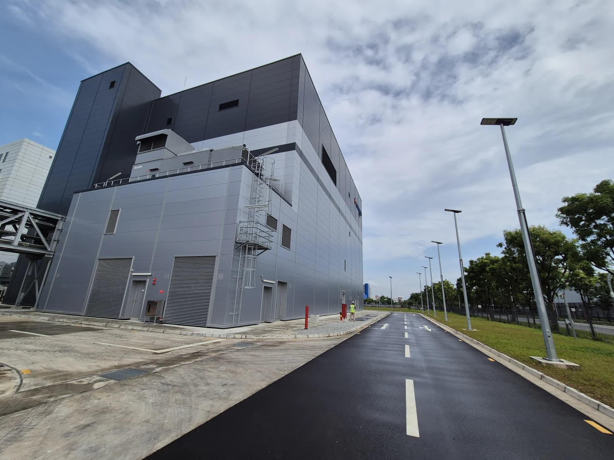 Production building corner viewed along the completed service road