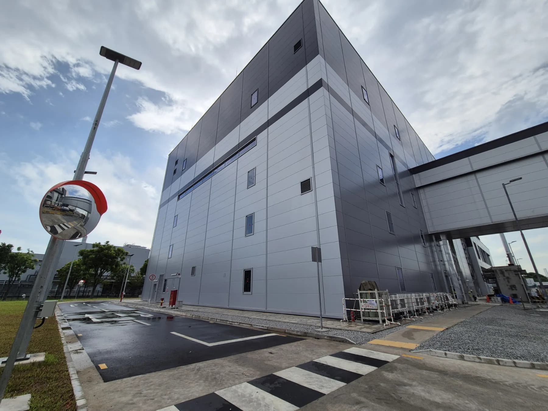 Completed metal-clad Novartis production building and sheltered connection