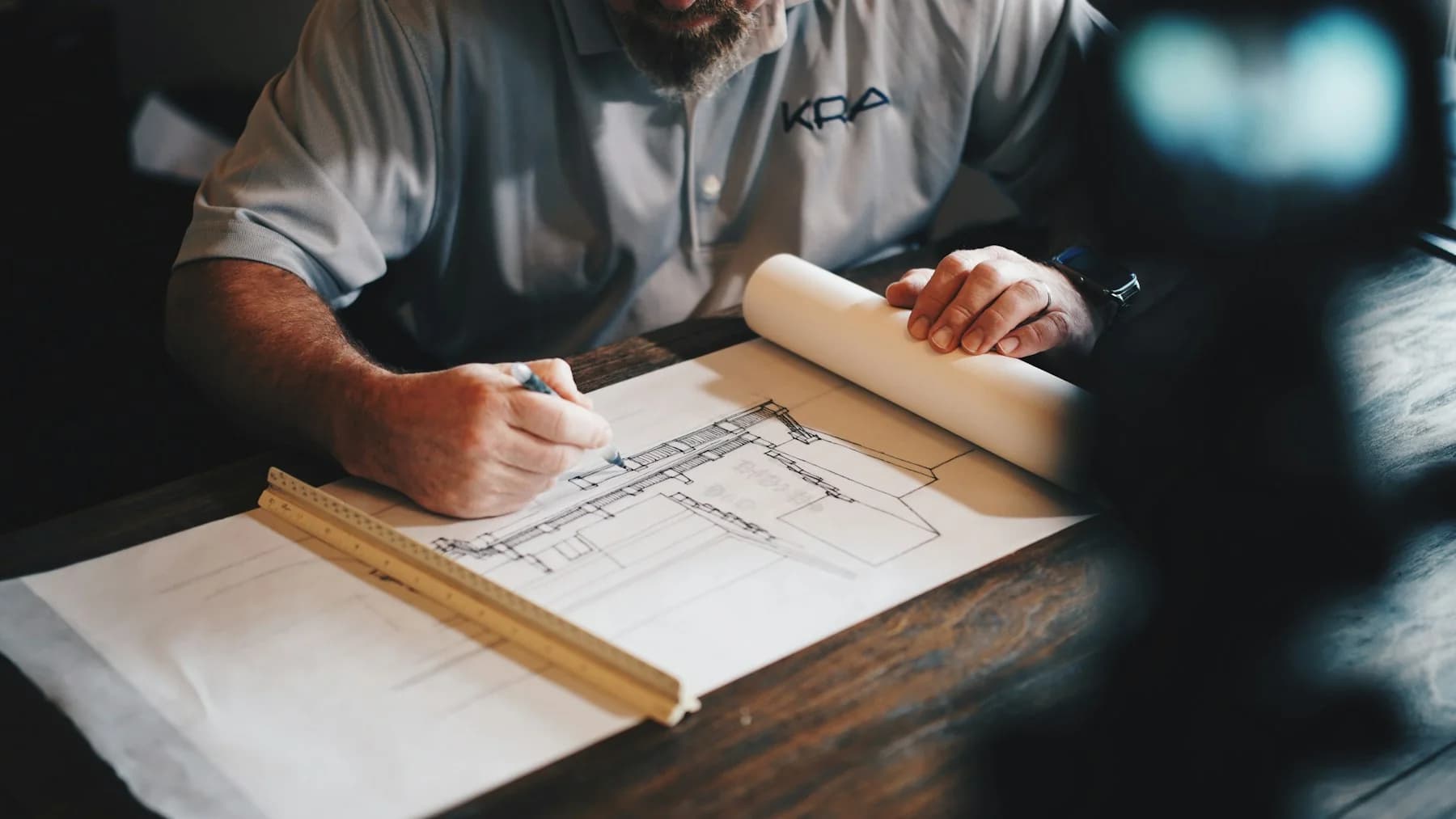 Architect developing a building plan by hand