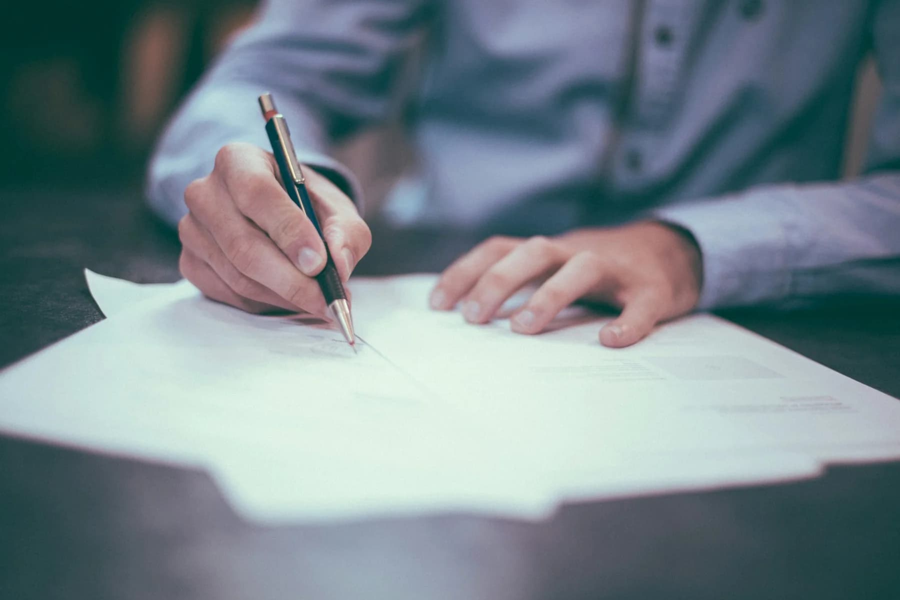 Professional reviewing and signing contract documents