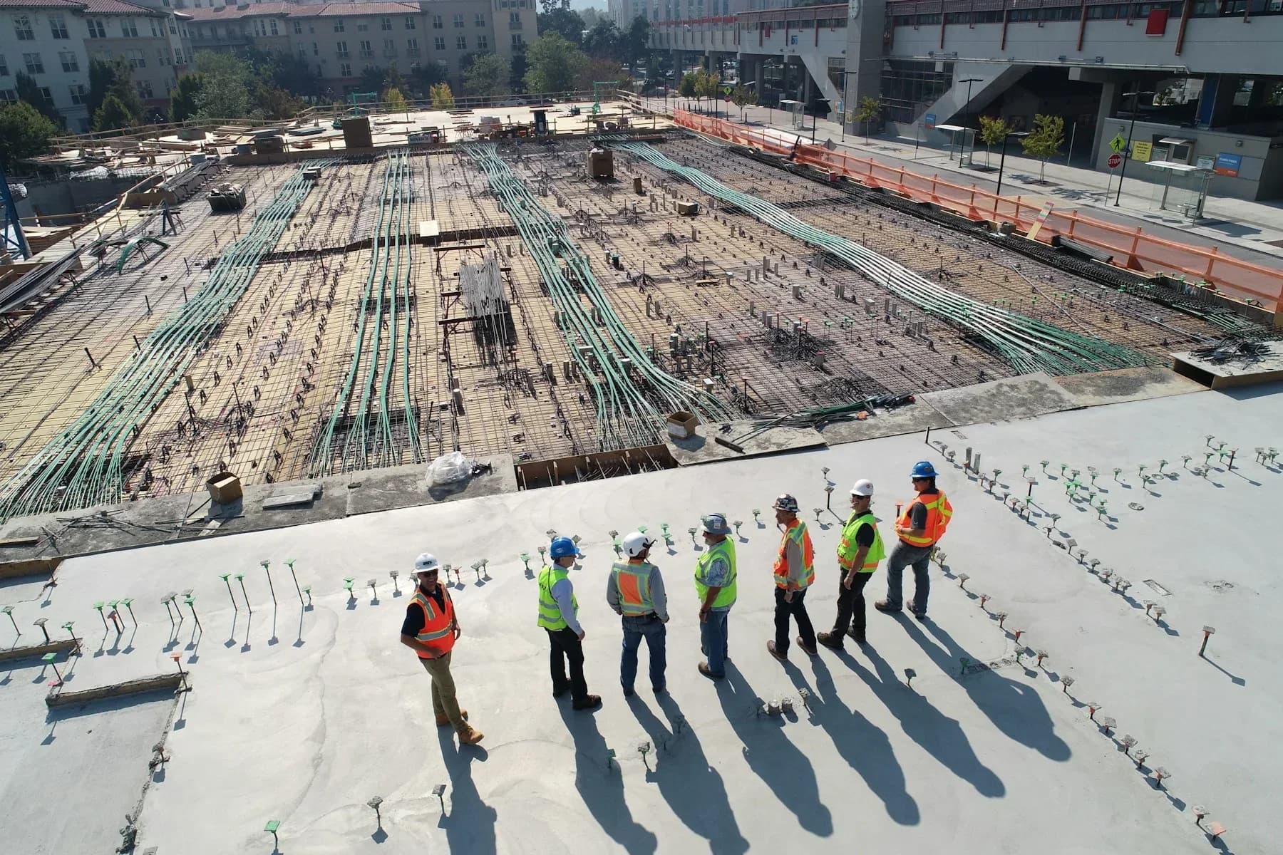 Construction professionals reviewing works on an active building site