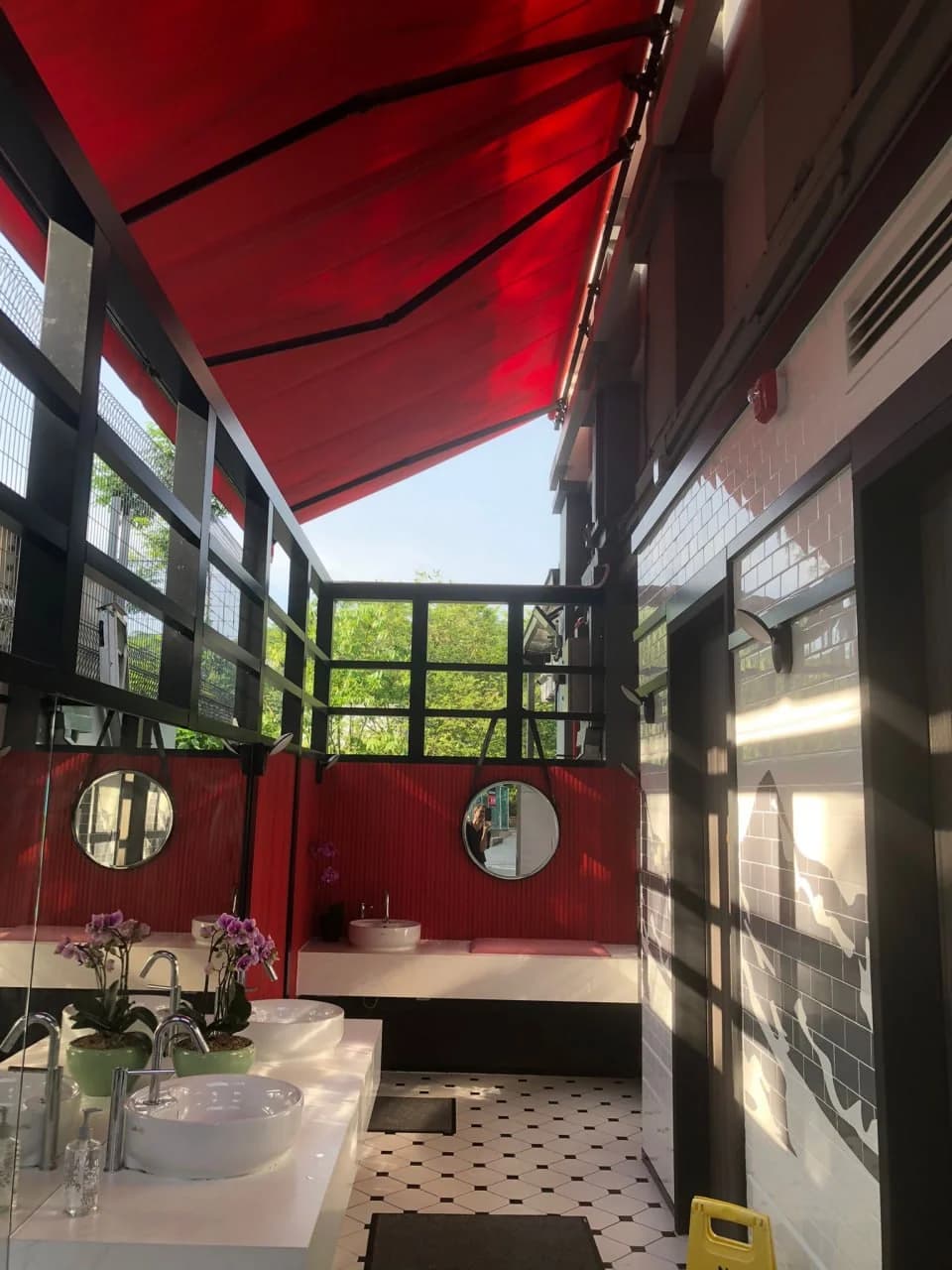Red-canopied washroom interior at Huber’s Butchery